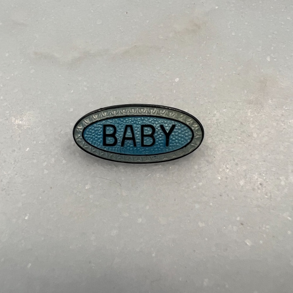 Vintage pin that says Baby